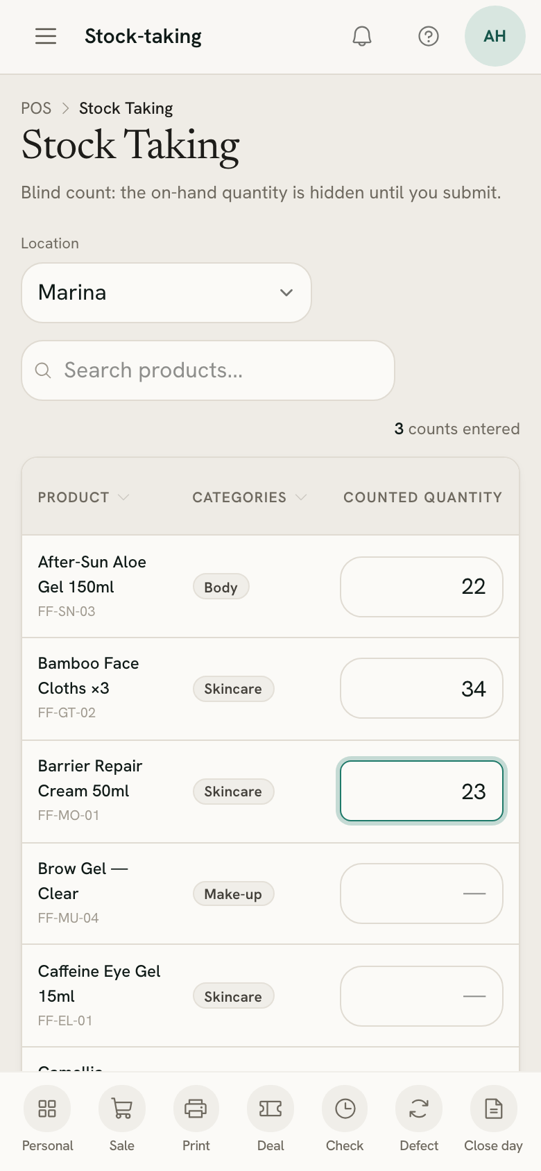 A stock count in progress on a phone, counted quantities typed on the first rows
