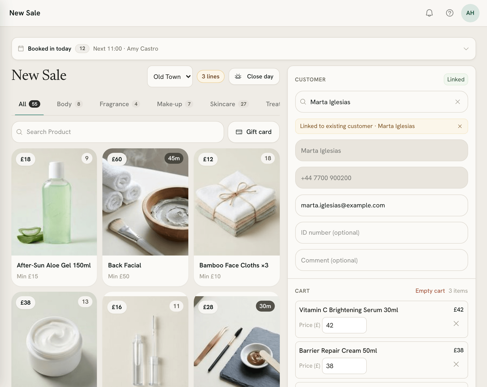 New Sale with product photos on the left and the customer and cart on the right