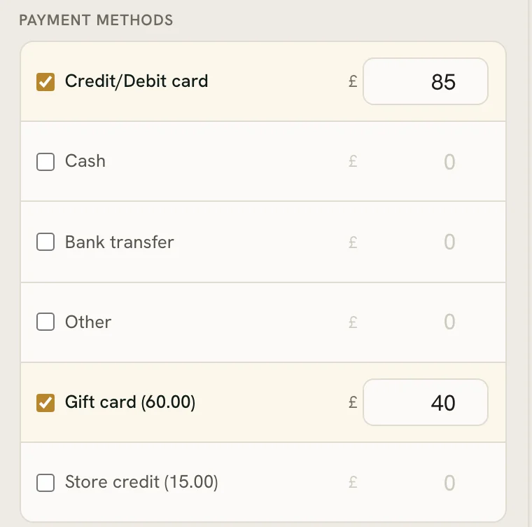 Taking payment: part on the card terminal, the rest from a gift card’s balance.